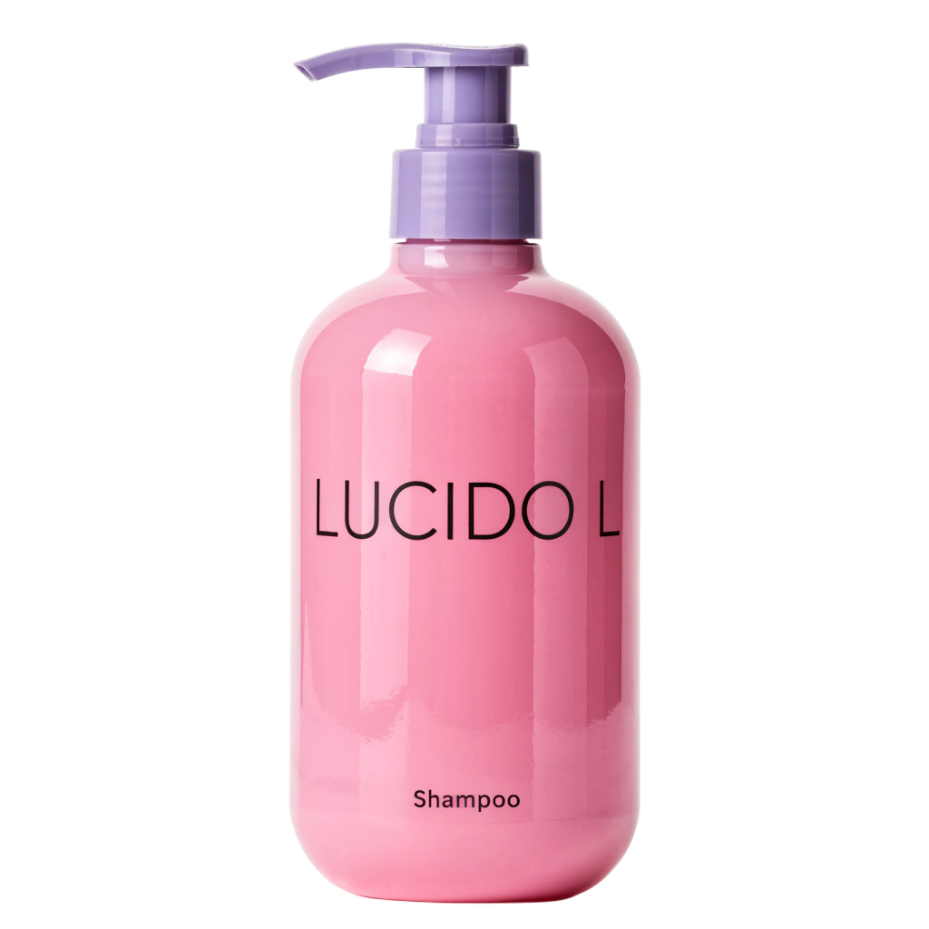 Pink LUCIDO-L shampoo bottle displayed against a clean, minimalist background with natural styling elements.